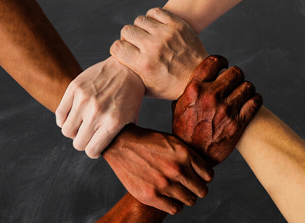 Hands clasped together in show of Support