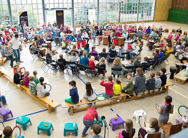 Large drumcircle made up of kids
